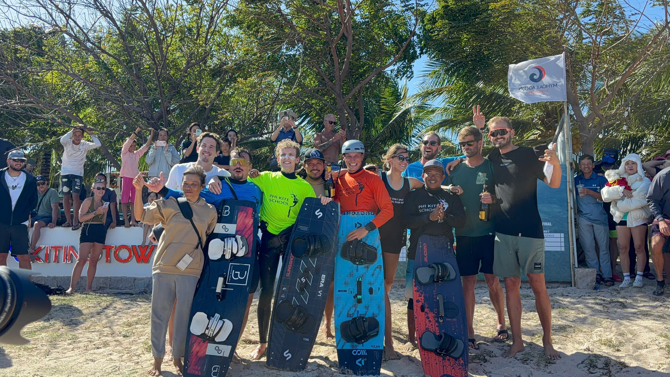 Kiteboarding friends gathered together on the beach
